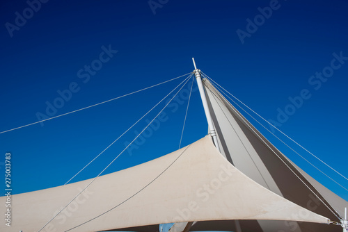 The white arbor was set against a blue sky