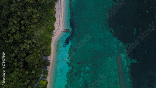 Beautiful aerial view of blue ocean beside beach
