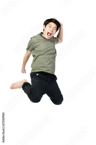 Portrait of happy little Asian child jumping isolated on white