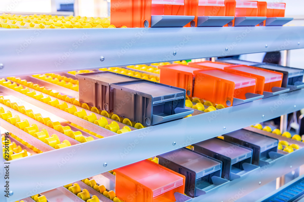 Plastic boxes on the roller conveyor. Modern warehouse equipment.