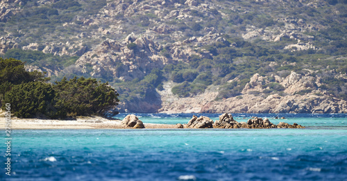Stunning view of the beautiful Cavalieri beach (Spiaggia di Cavalieri) bathed by a turquoise clear sea. Maddalena Archipelago National Park, Sardinia, Italy.