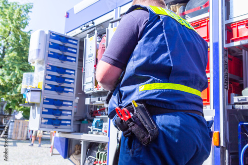 German technical emergency service man on an equipment truck man photo