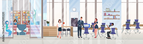 businesspeople discussing new project during meeting successful teamwork concept open space creative co-working center modern workspace interior flat horizontal full length