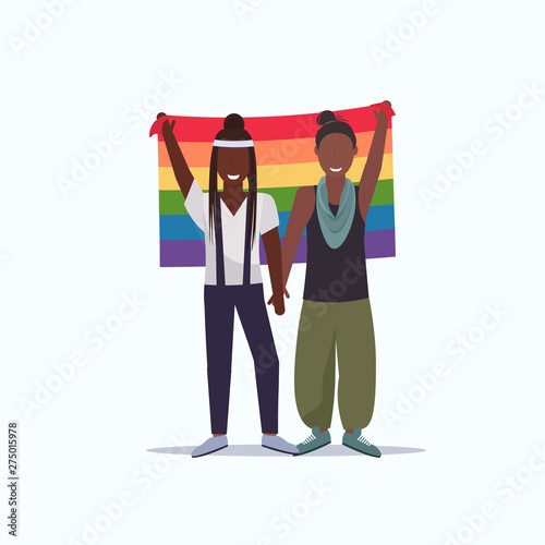 women couple holding rainbow flag love parade lgbt pride festival concept two african american lesbians female cartoon characters standing together full length flat