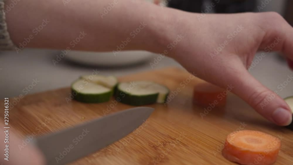 Female hands chopping aubergine. Woman hands cutting eggplant.
Vegan vegetarian food cooking Female hands chopping aubergine. Woman hands cutting eggplant.
Vegan vegetarian food cooking