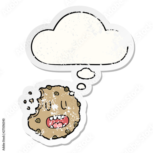 cartoon cookie and thought bubble as a distressed worn sticker