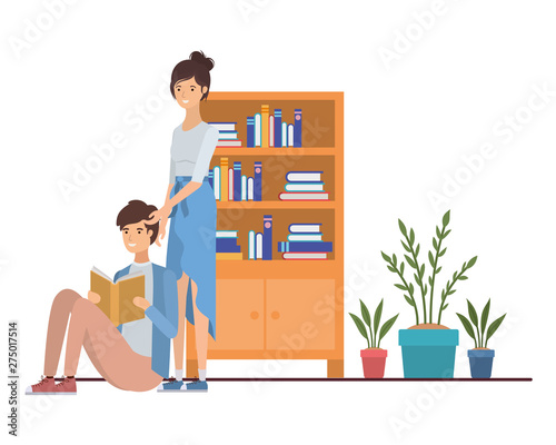 couple with book in hands in living room