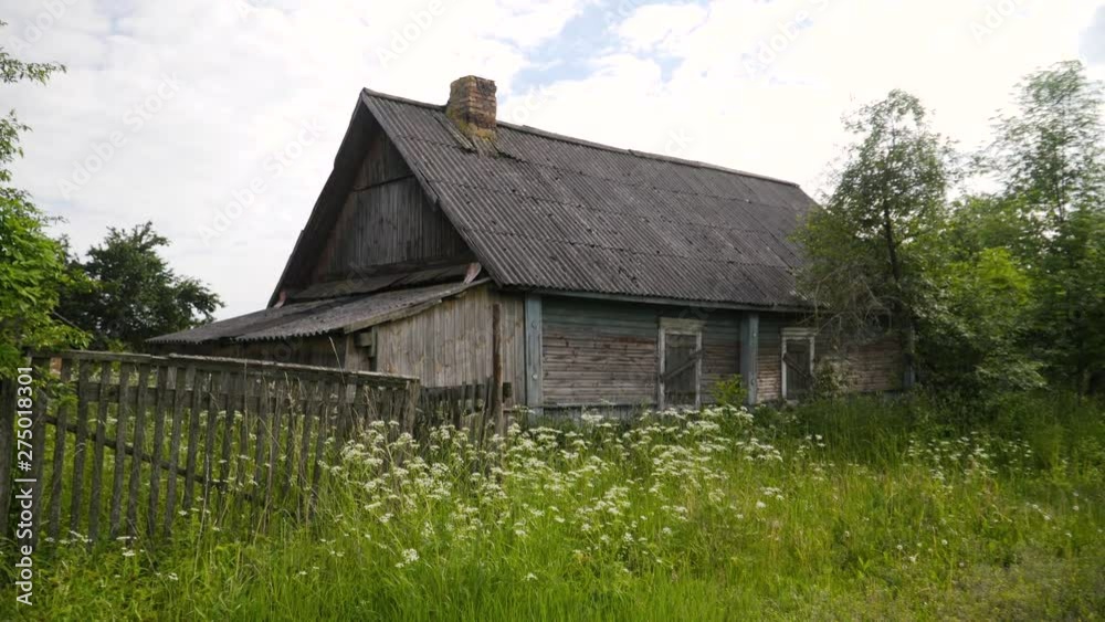 Abandoned house in the village. Deserted village. Old wooden house in the village. Wooden house with boarded-up Abandoned house in the village. Deserted village. Old wooden house in the village. Wooden house with boarded-up