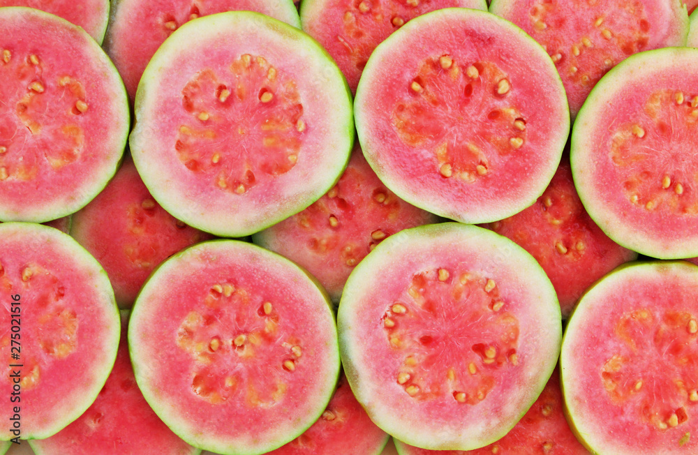 Ταπετσαρία Slices of pink guava as background