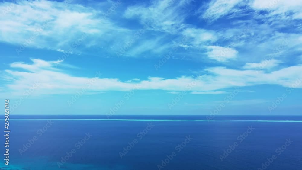 ocean background, Blue Sky with white clouds And Tranquil Water At Open Sea With Horizon ocean background, Blue Sky with white clouds And Tranquil Water At Open Sea With Horizon