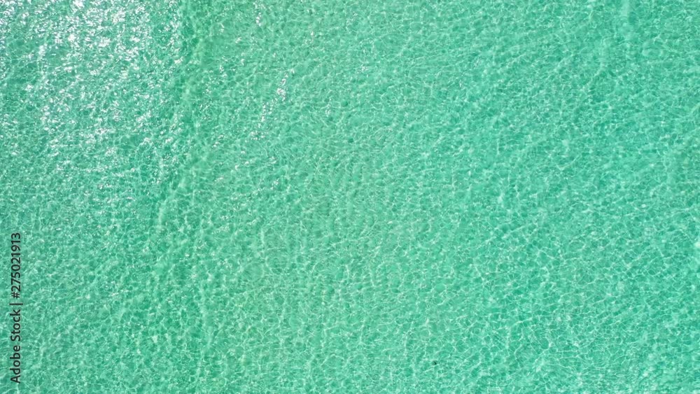 Abstract sea water texture, aerial drone high angle shot of tropical sea crystal clear turquoise water Philippines