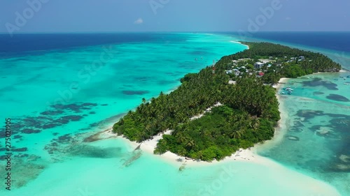 Southern Maalhosmadulu Atoll, small island with luxury resorts, Fulhadhoo, maldives, aerial drone parallax shot photo