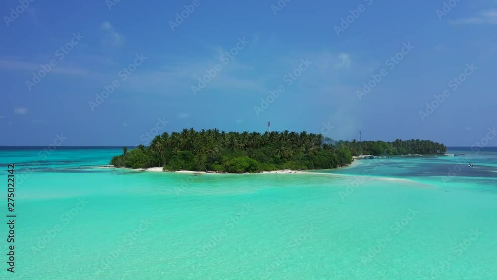 boat parallax shot of a White sand Beach with crystal clear water of Rangiroa Atoll, French Polynesia boat parallax shot of a White sand Beach with crystal clear water of Rangiroa Atoll, French Polynesia