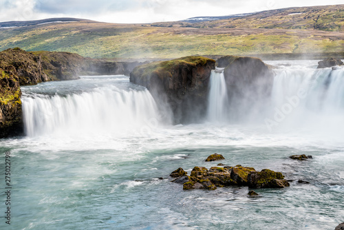 Godafoss  Iceland waterfall view of the gods with long exposure smooth motion of water falling off cliff in summer landscape