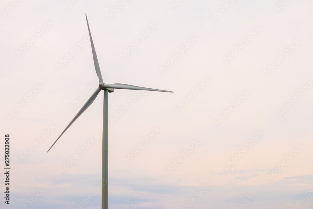 Wind turbine farm power generator in beautiful nature landscape for production of renewable green energy is friendly industry to environment.