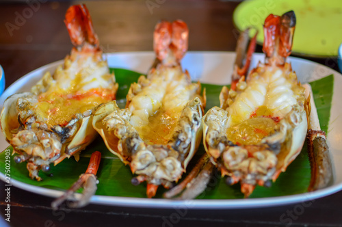 Grilled giant river prawn on white dish. Popular Thai food.