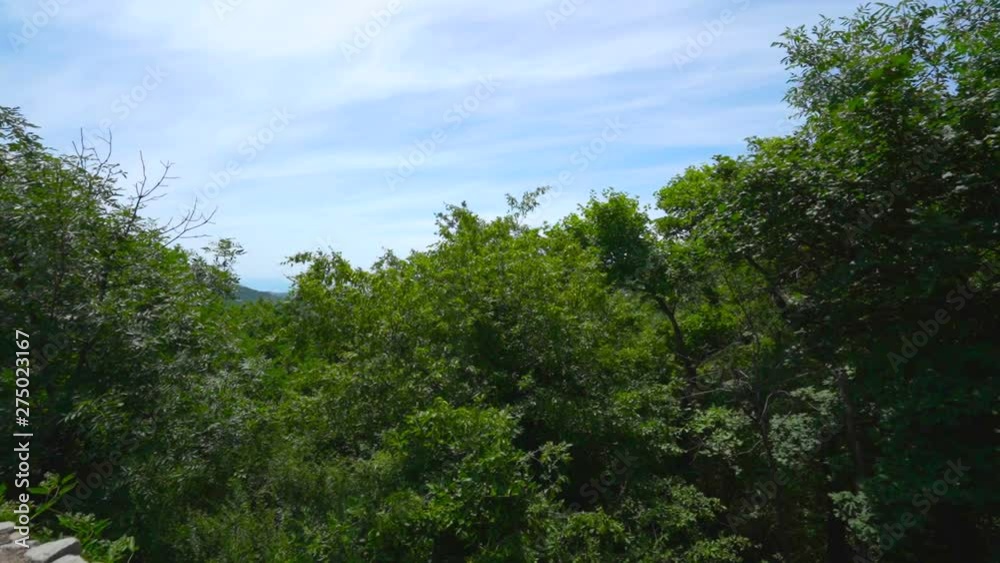 View from mountain road on forest slope of Black Sea coast on southern shore of Crimea near Alushta city and Luchyste village. Gimbal stabilized movement. View from mountain road on forest slope of Black Sea coast on southern shore of Crimea near Alushta city and Luchyste village. Gimbal stabilized movement.