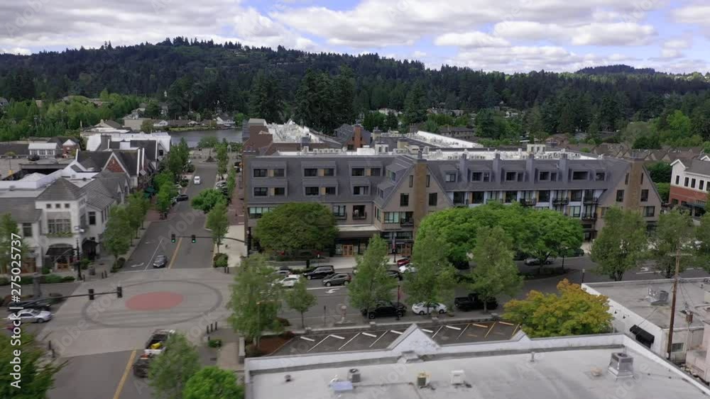 Aerial dolly trucking shot showing downtown lake oswego and apartment buildings.
