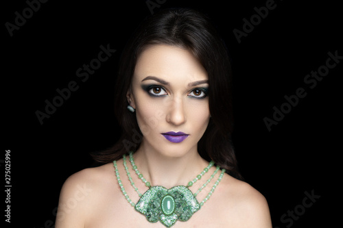 beautiful adult woman, green jewelry, hairstyle