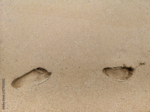 footprint on the beach sand.