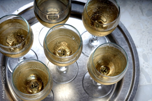 glasses with sparkling wine on a metal dressing