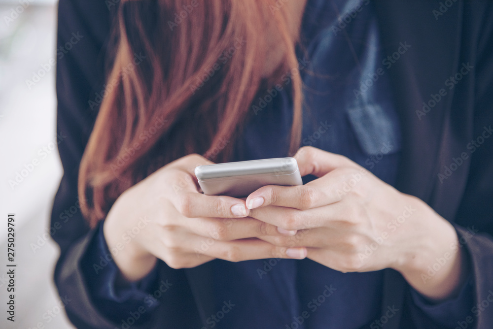 Woman using smartphone shopping online and call with technology lifestyle. Smiling face of asian woman holding cellphone with E-commerce Shopping online website Reading Online Article, Blog and vlog.