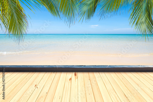 Wooden floor or plank on sand beach in summer. background. For product display.