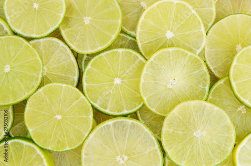 Background of ripe sliced limes