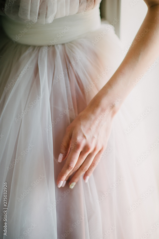 Part of the bride's wedding dress close up