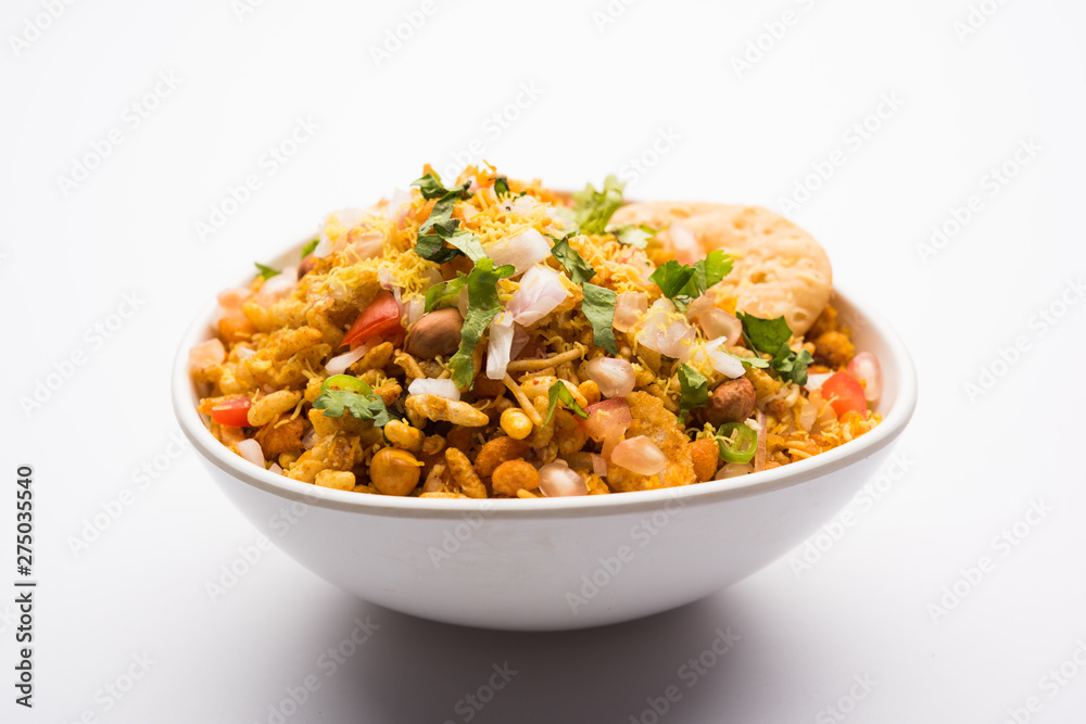 Bhelpuri Chaat/chat is a road side tasty food from India, served in a bowl or plate. selective focus