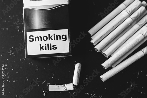 Broken cigarettes. Dangerous habit. Harmful for health. Smoking kills.