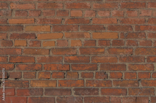 Background of orange and brown brick wall texture
