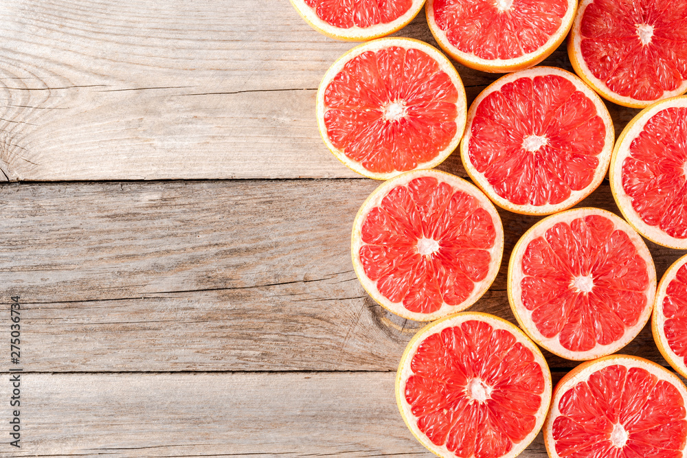 Fresh grapefruits on wooden table with copyspace Fresh grapefruits on wooden table with copyspace