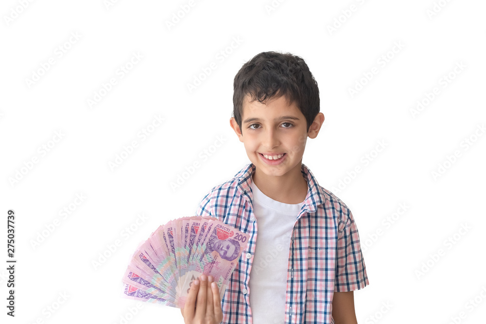 Portrait of a happy teenager holding ukrainian money hryvnia isolated on white background. Cost of education in Ukraine Portrait of a happy teenager holding ukrainian money hryvnia isolated on white background. Cost of education in Ukraine
