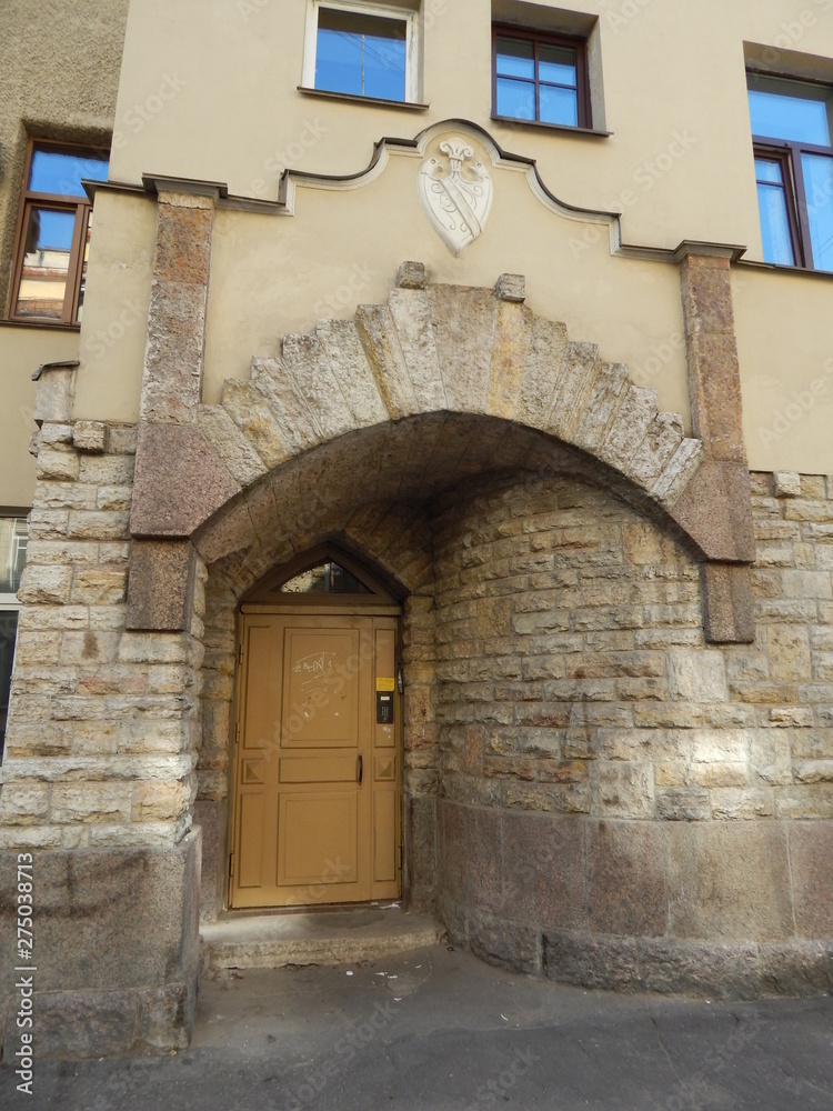 The door to the building, the stone facing of a beautiful building