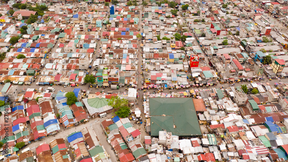 Streets of poor areas in Manila. The roofs of houses and the life of people in the big city. Poor districts of Manila, view from above. Manila, the capital of the Philippines.