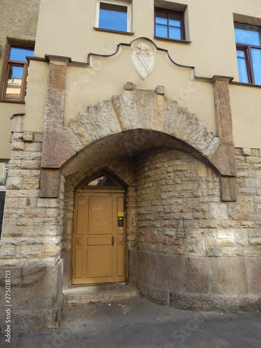 The door to the building, the stone facing of a beautiful building © HelenkaNNN