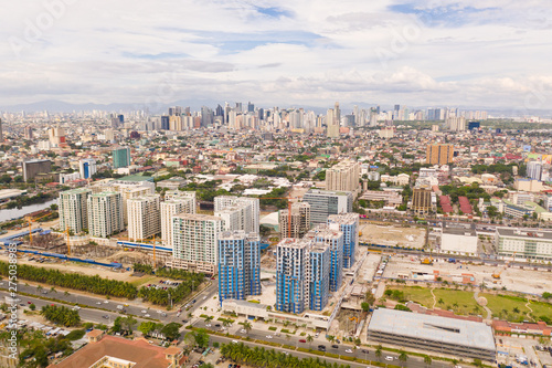 Construction of high modern houses in Manila. The city of Manila, the capital of the Philippines. Modern metropolis in the morning, top view. New buildings in the city.