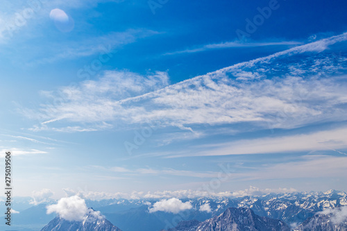 Panoramic view of the European Alps from the top of Zugspitze on a sunny summer day