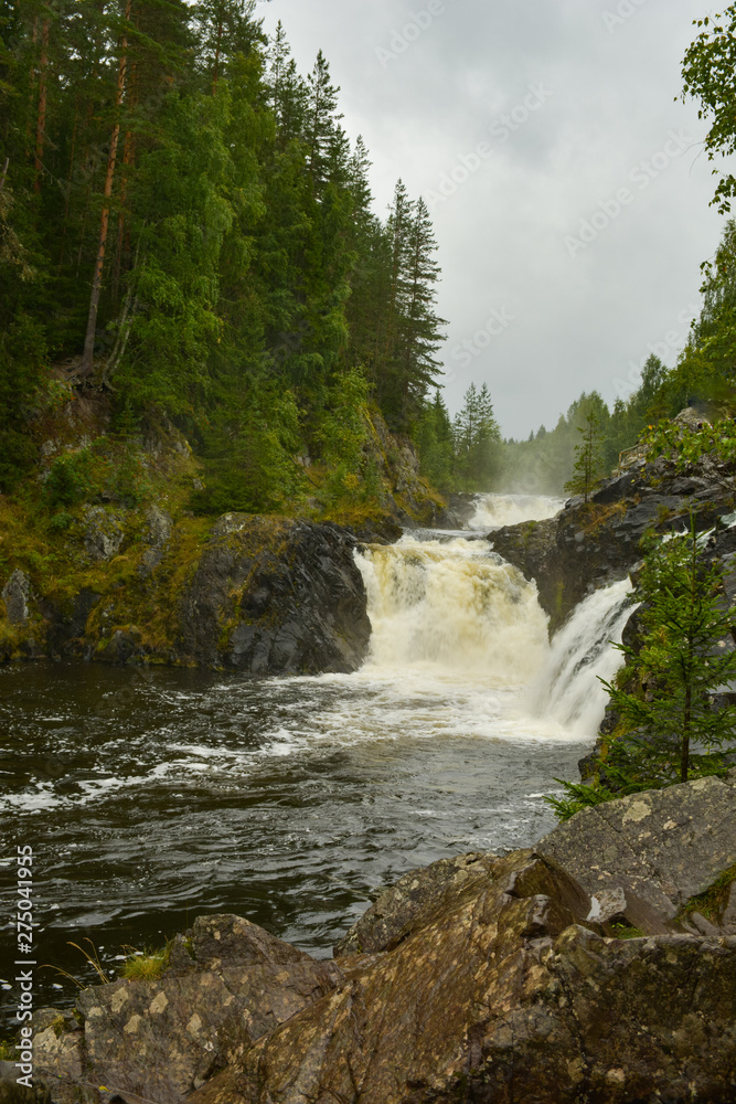Water on the steps of the waterfall Kivach