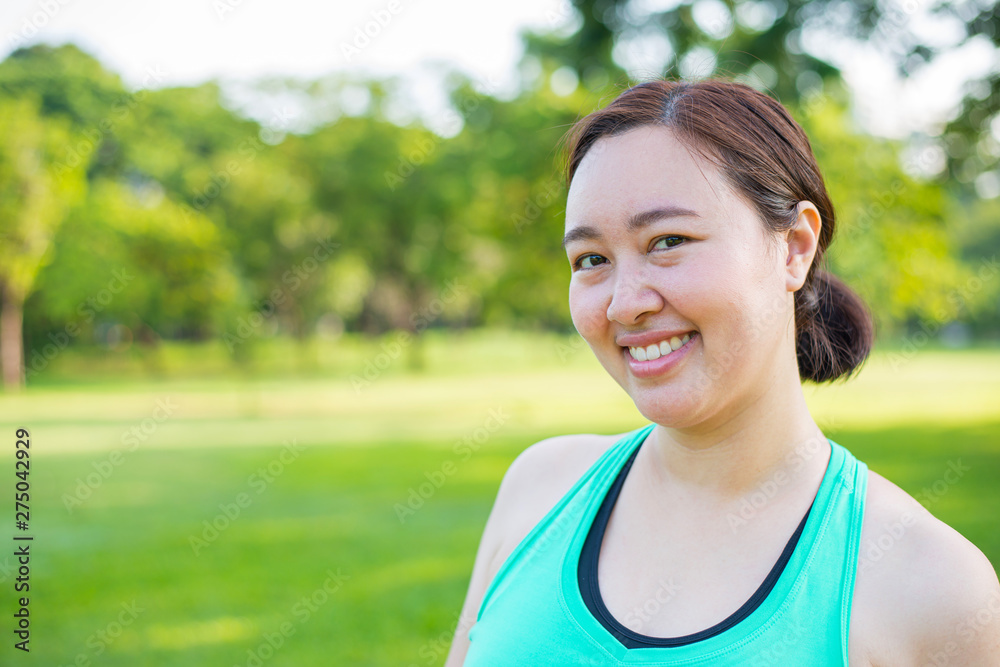 Portrait of gorgeous young woman practicing yoga outdoor.