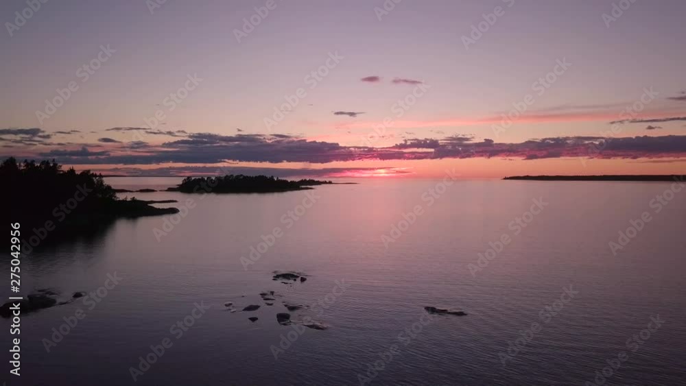 Aerial Drone View, Slow panning sideways. In Öregrund Sweden at a beautiful sunset on Midsummer night. Aerial Drone View, Slow panning sideways. In Öregrund Sweden at a beautiful sunset on Midsummer night.