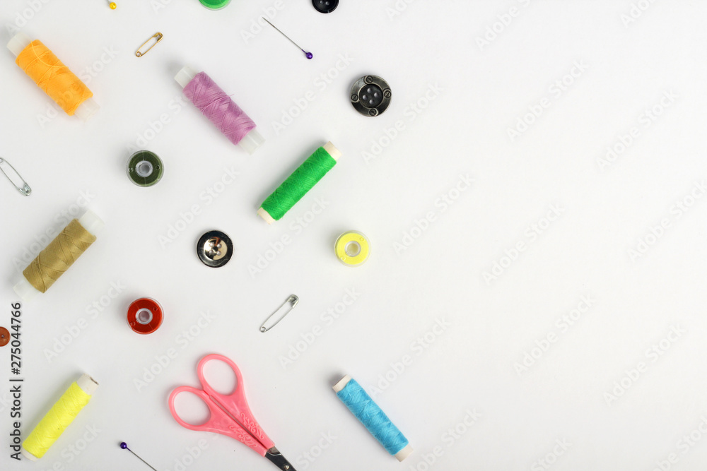 White background with different tools for sewing and tailoring White background with different tools for sewing and tailoring