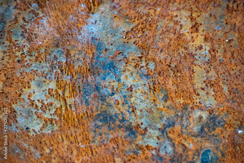 Yellow and blue rusty metal plate