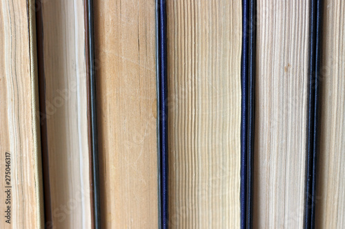 Stack of paper retro books close up, vintage background.