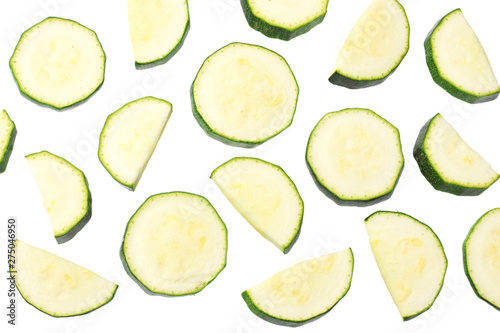 fresh green zucchini slices isolated on white background. top view