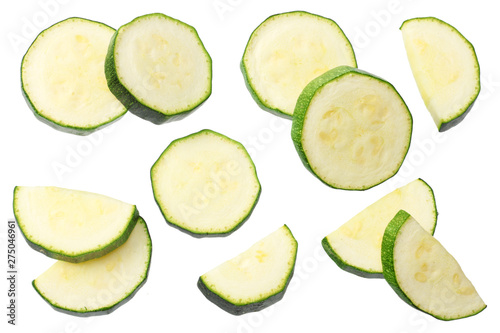 fresh green zucchini slices isolated on white background. top view