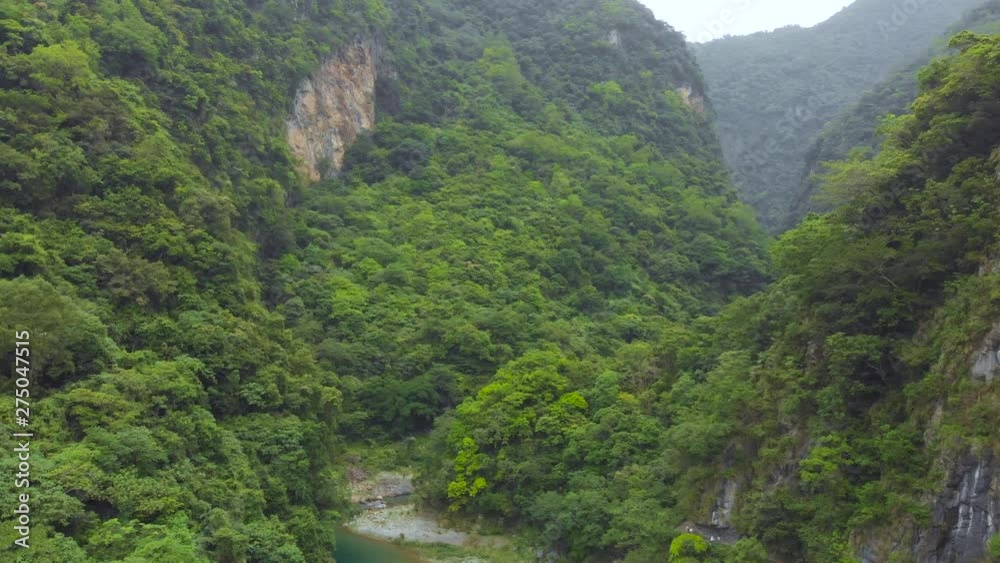 AERIAL - Drone Flies in Mountain Gorge Over River Near Bridge With Cars in Taiwan Taroko Gorge AERIAL - Drone Flies in Mountain Gorge Over River Near Bridge With Cars in Taiwan Taroko Gorge