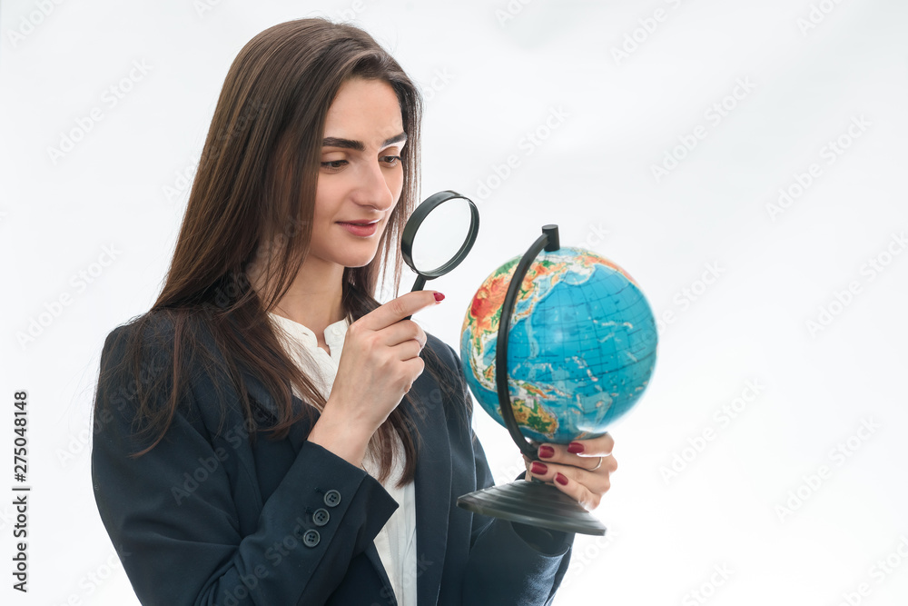Woman looking at globe with magnifying glass isolated Woman looking at globe with magnifying glass isolated