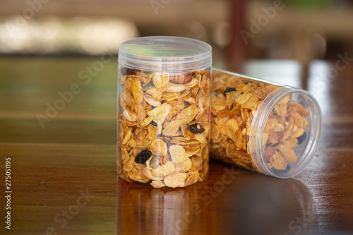Homemade organic healthy granola with dried fruits in bottles